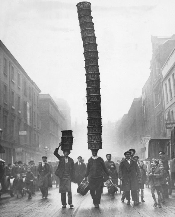 Covent Garden porter carrying a basket 'Eiffel Tower', 1928.