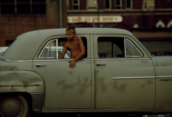 Boy in car, USA. 1965