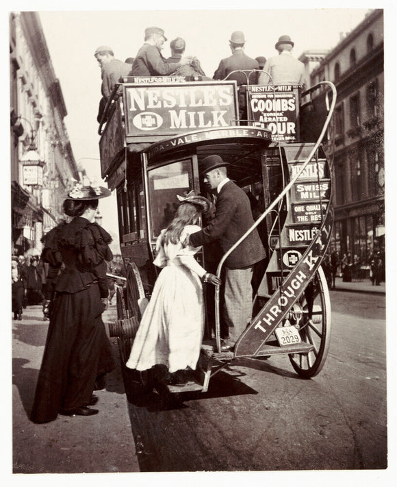 Boarding a bus, about 1900