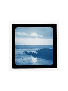 A magic lantern slide showing a seascape with rocks by Birt Acres, c. 1893. (Blue carbon for projection).