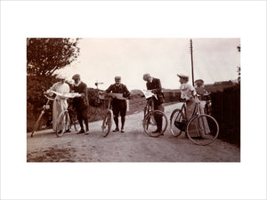 Cyclists looking at maps, c 1900.