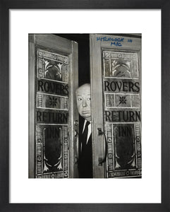 Alfred Hitchcock at the doors of Coronation Street's Rovers Return