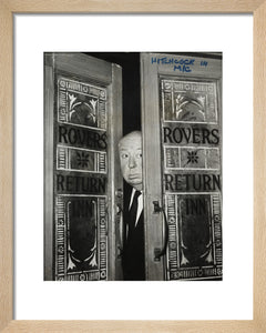 Alfred Hitchcock at the doors of Coronation Street's Rovers Return
