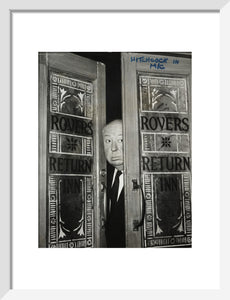 Alfred Hitchcock at the doors of Coronation Street's Rovers Return