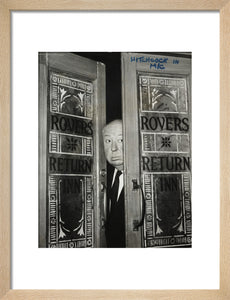 Alfred Hitchcock at the doors of Coronation Street's Rovers Return