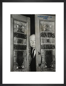 Alfred Hitchcock at the doors of Coronation Street's Rovers Return