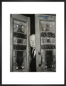 Alfred Hitchcock at the doors of Coronation Street's Rovers Return