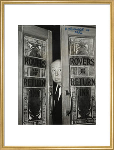 Alfred Hitchcock at the doors of Coronation Street's Rovers Return