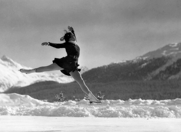 Woman ice-skater caught in mid-air, c 1920s.