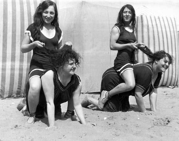 Horseplay on the beach, c 1920s.