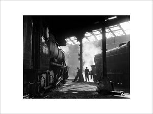 Grimy 8F and Class 5 steam locomotives in a