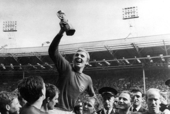 Bobby Moore holding the World Cup, Wembley, 1966.