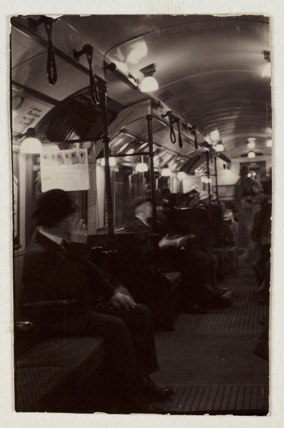 Interior of an underground train carriage, London, c 1930.