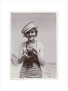 Woman taking a photograph, about 1935