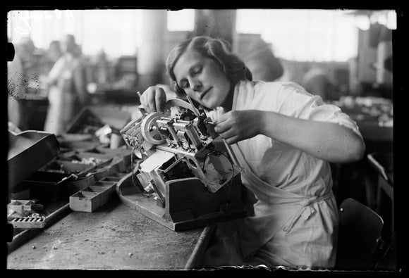 Woman working on the asembly line at the HMV works, Hayes, 8 August 1932.