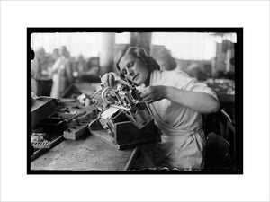 Woman working on the asembly line at the HMV works, Hayes, 8 August 1932.