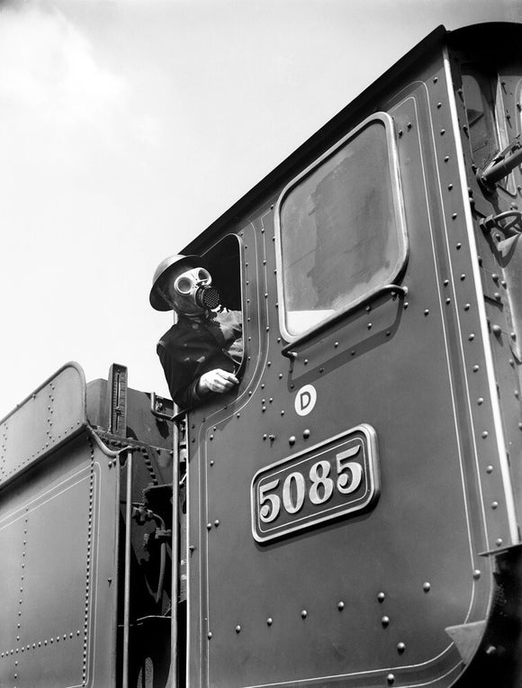 Train driver with a gas mask, World War Two, 21 August 1940.