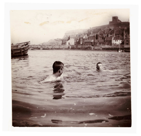 Two boys swimming in Whitby Harbour, North Yorkshire, c 1902.