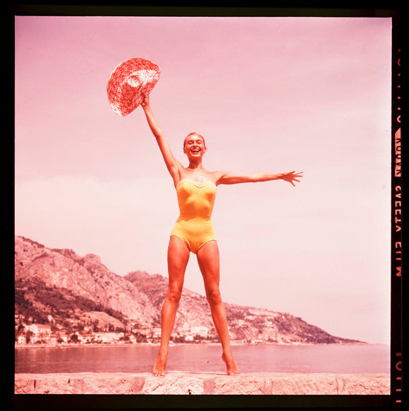 Woman in a yellow swimsuit, 1960s.