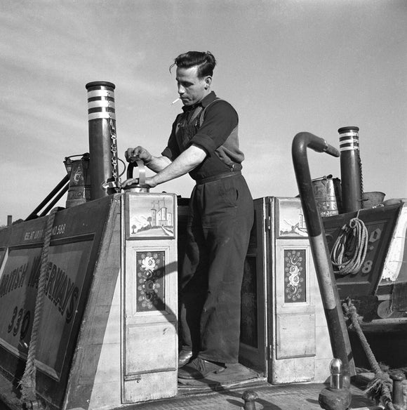 'John Berrall cleaning his brasses at the lay by, Southall, Greater london, 1950.