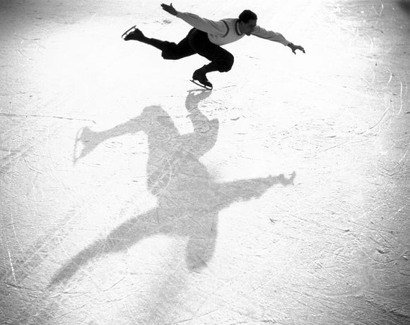 Ice-skater casting a shadow, c 1930s.