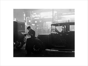 Taxis queueing in traffic during bad fog in central London, 1934. Photograph by James Jarche (1891-1965).