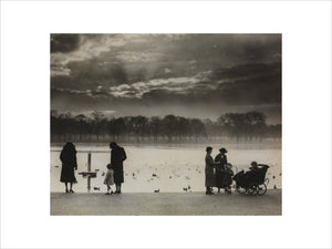 Walkers enjoying the sunset across the Serpentine in Hyde Park, 1938