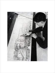 Draughtsman Brian Pearson, an employee in the Drawing Office, working on drawing for War Department. 1945.