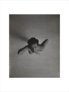 Standing naked woman looking up to camera