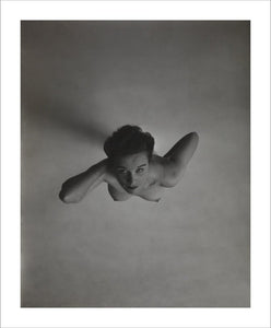 Standing naked woman looking up to camera