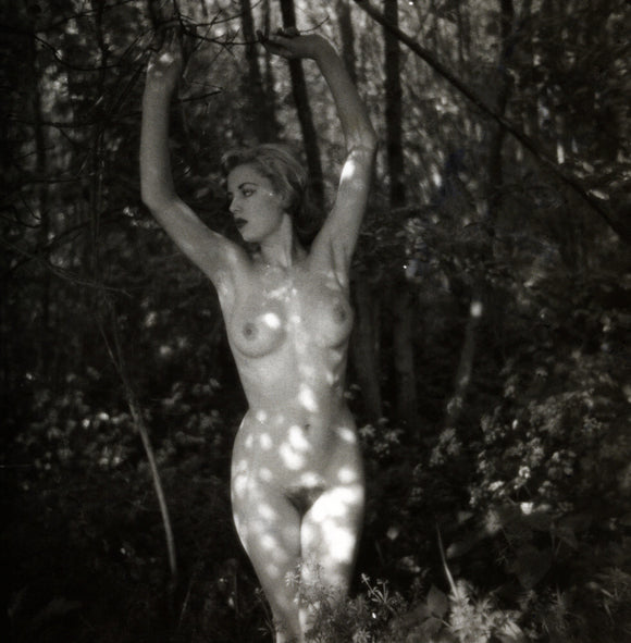 Naked woman in woods