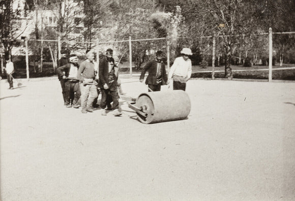 Rolling the Tennis Courts.